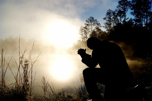 Talking to God, silently.